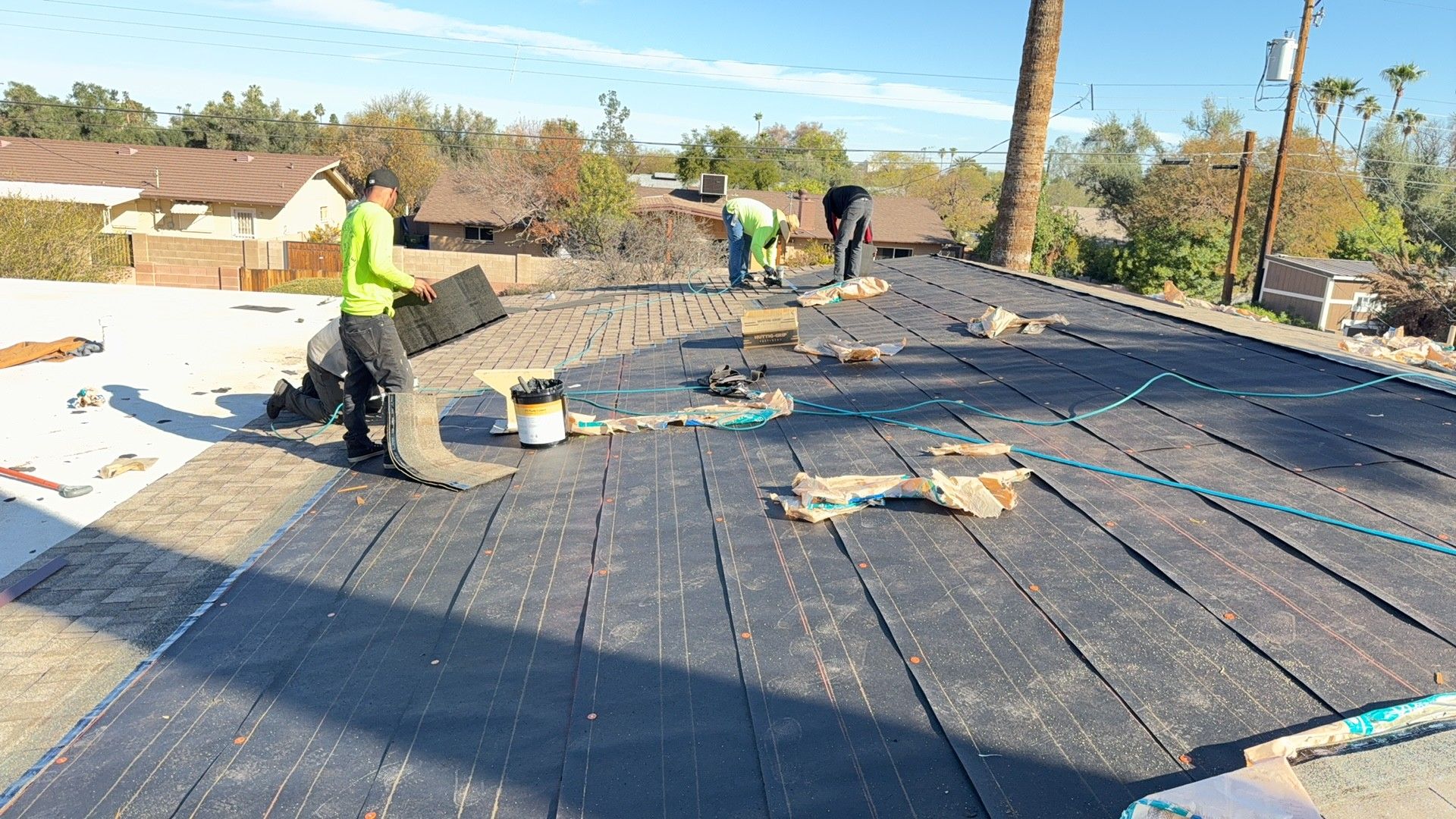Tear-off in progress · Tempe · 85282 — Aged shingles and brittle underlayment on a large Tempe ranch home — homeowner wanted it fixed before monsoon.