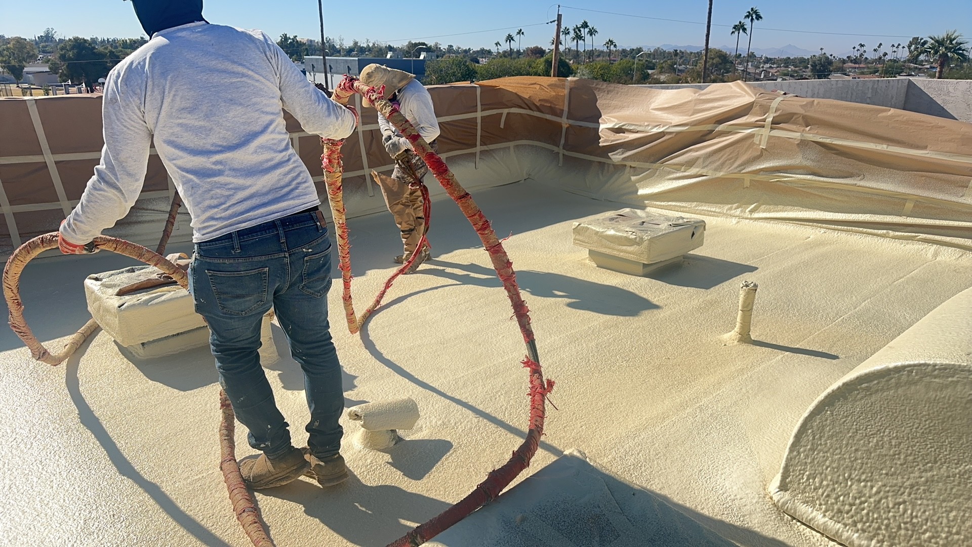 Foam spray application · N. Center, Mesa 85201 — End-of-life roof with active leaks — owner wanted a seamless system without tearing off the existing deck.