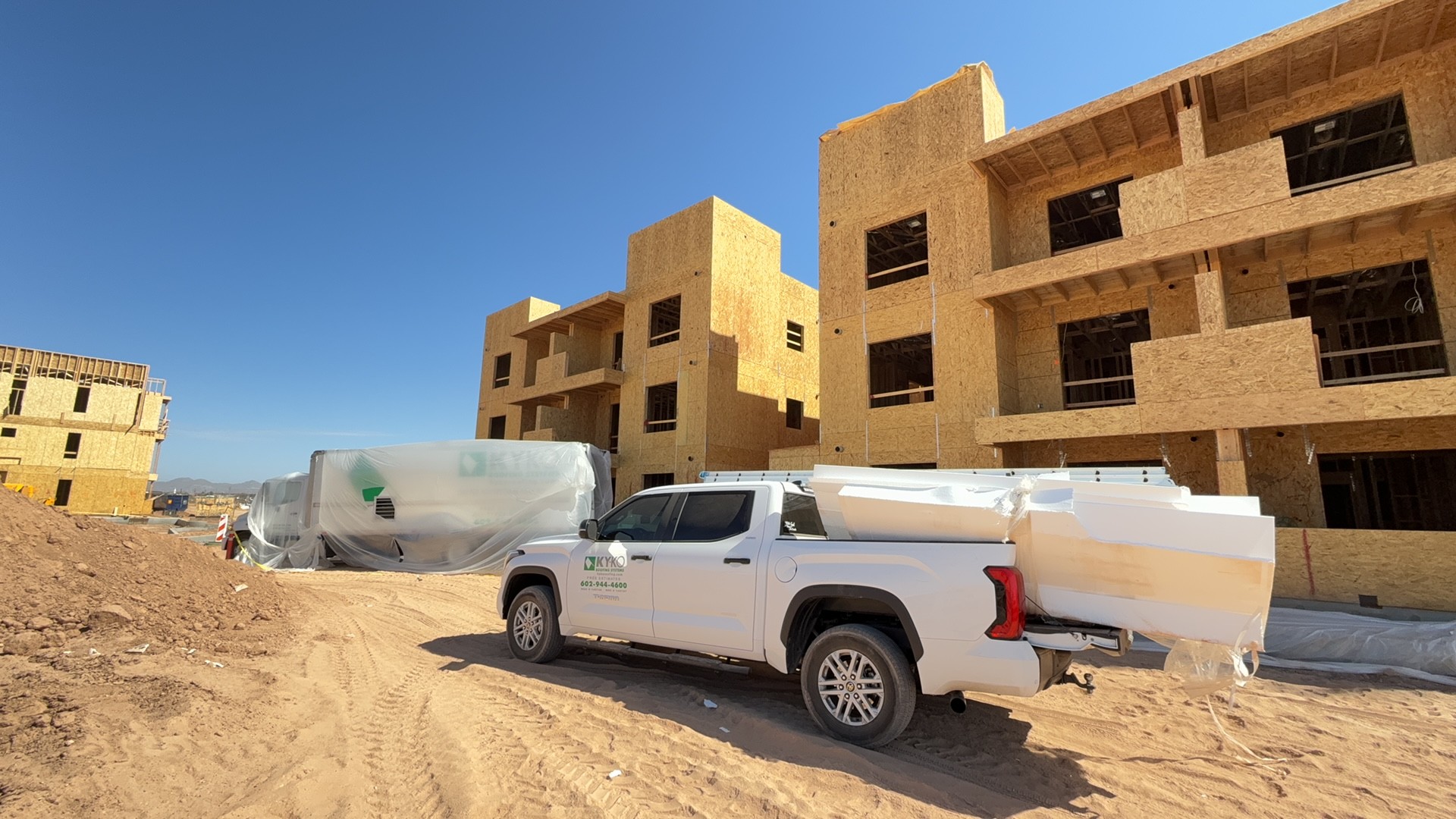 Multi-family foam roof · Mesa 85212 — New three-story multi-family build needed an energy-efficient low-slope system spec'd before dry-in.