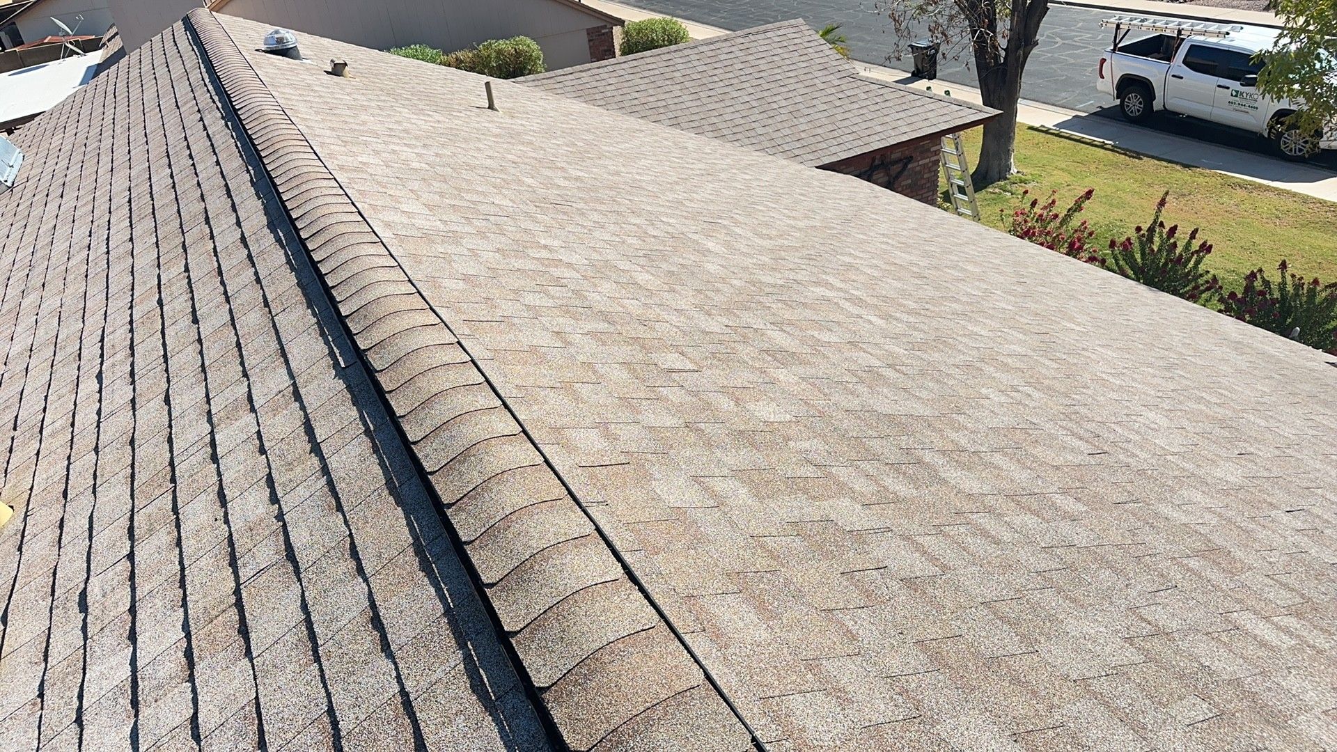 Architectural shingle re-roof · Mesa · 85203 — Sun-faded three-tab roof at end of life — homeowner wanted a clean architectural upgrade with proper ridge ventilation.